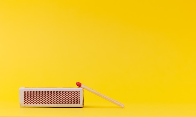 Pack of matches isolated on a yellow background