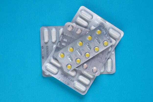 A pack of pills on a blue background