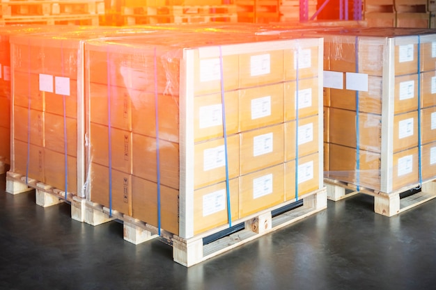 Package boxes wraaped plastic film on pallets in storage
warehouse cargo shipping warehouse