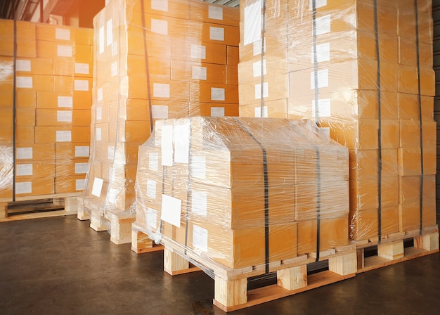 Package boxes wrapped plastic on pallets at storage warehouse
shipment boxes