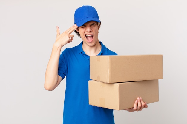 Package deliver man looking unhappy and stressed, suicide gesture making gun sign