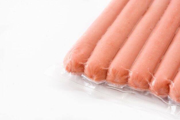 Packaged sausages isolated on white Copyspace