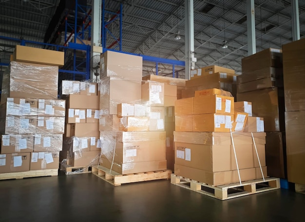 Packaging boxes stacked on pallets in storage warehouse supply\
chain storehouse shipping warehouse