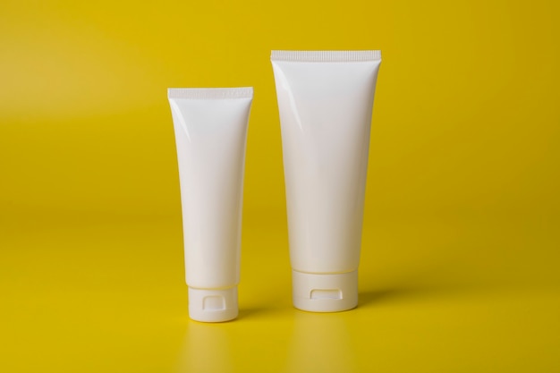 Packaging cosmetics bottle for mockup on yellow background