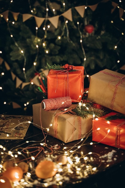 Photo packed new years gifts near the christmas tree