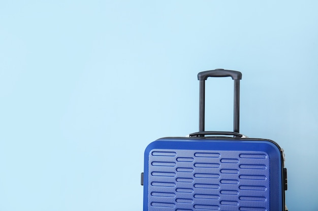 Packed suitcase on color background. Travel concept