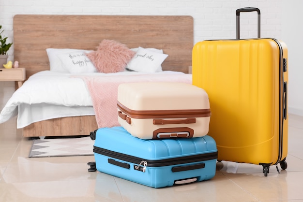 Packed suitcases in bedroom