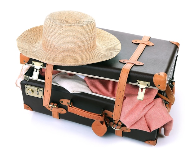 Packing suitcase for trip isolated on white