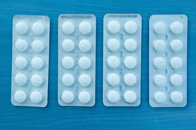 Packings of white pills of medicines