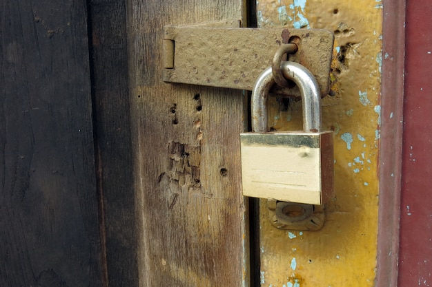 Photo pad lock on the wooden door