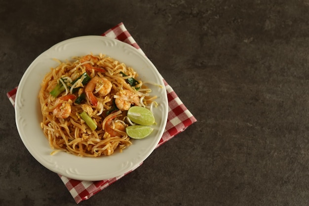 Pad thai is a stir-fried rice noodle dish commonly served as a Thailand street food.