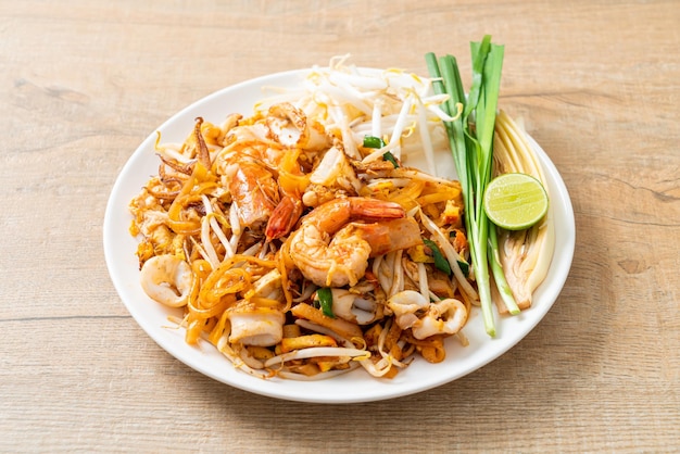 Pad Thai Seafood - Stir fried noodles with shrimps, squid or octopus and tofu in Thai style