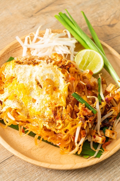 Pad Thai - stir fried noodles in Thai style with egg - Asian food style