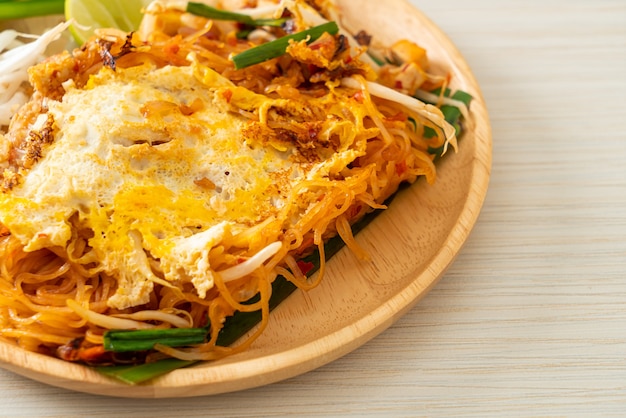 Pad Thai - stir fried noodles in Thai style with egg - Asian food style