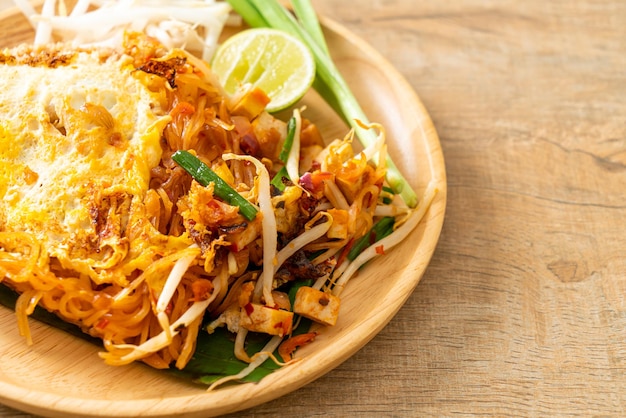 Pad Thai - stir fried noodles in Thai style with egg - Asian food style