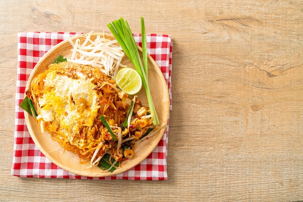 Pad Thai - stir fried noodles in Thai style with egg - Asian food style