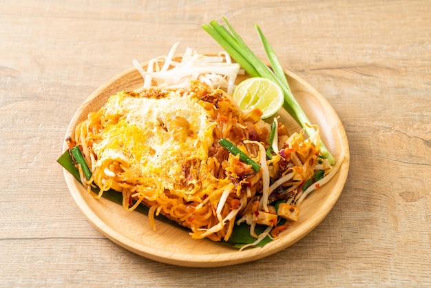 Pad Thai - stir fried noodles in Thai style with egg - Asian food style