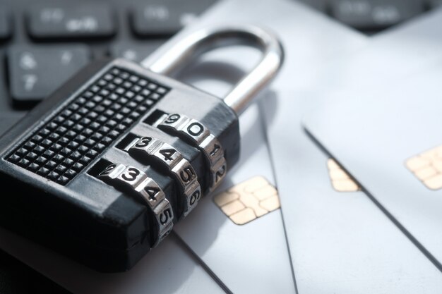 Padlock and credit cards on laptop. Internet data privacy information security concept