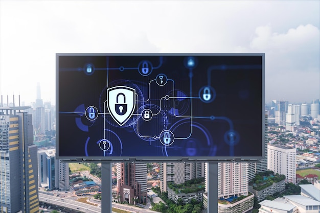 Padlock icon hologram on road billboard over panorama city view of Kuala Lumpur at day time to protect business Malaysia Asia The concept of information security shields