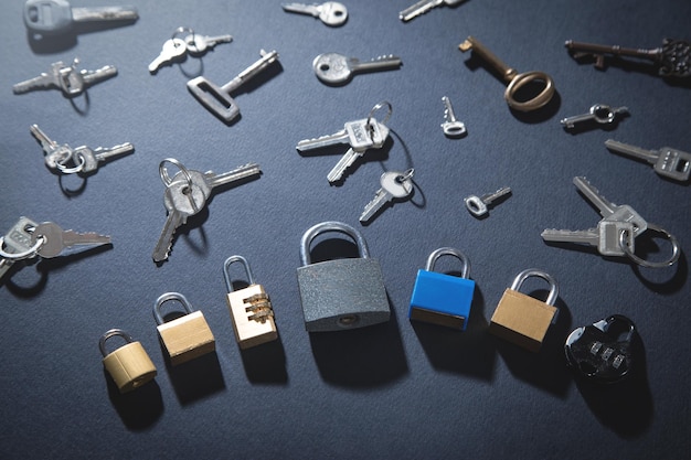 Padlock and keys on the black background