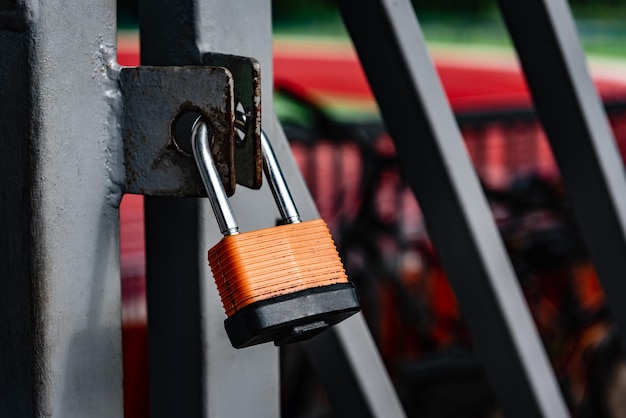 Padlock on metal gate, security and protection.