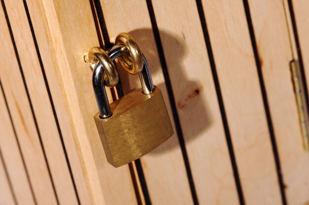 Padlock on wooden door