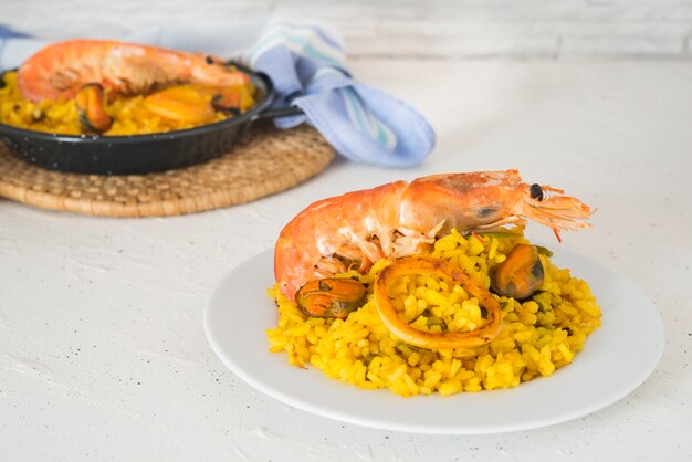 Paella typical spanish food in granite background