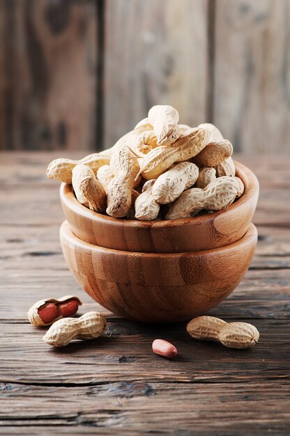 Paenut in the bowl in the wooden table