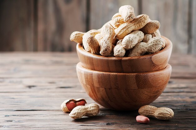 Paenut in the bowl in the wooden table