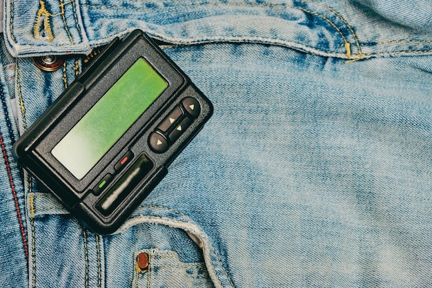 Pager is an old retro gadget for communication on jeans