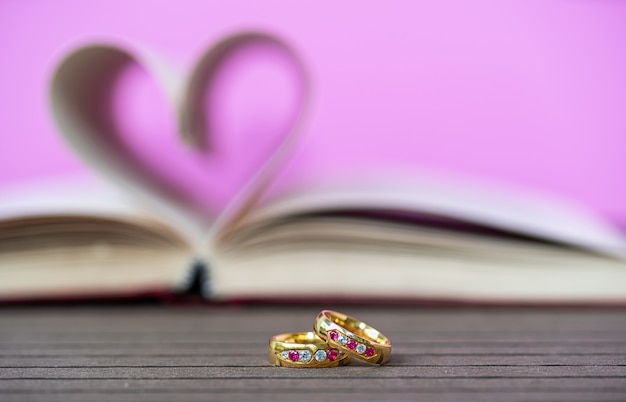 Pages of book curved heart shape and weeding ring