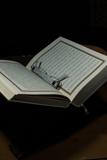 Photo pages of holy koran and glasses