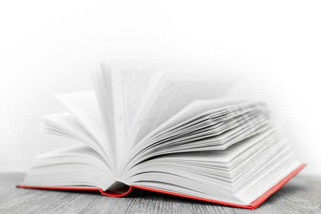 Pages of a new book on wooden table