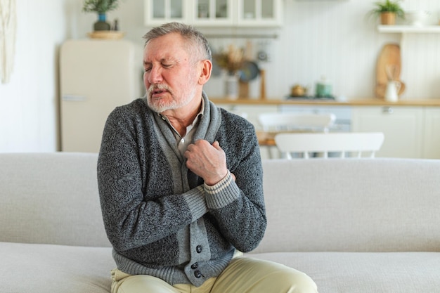 Pain on heart heart attack unhappy middle aged senior man suffering from chest pain heart attack