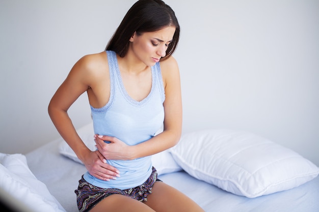 Pain stomach. Woman having painful stomachache,Female suffering from abdominal pain