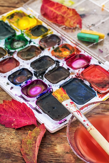 Paint on the autumn table