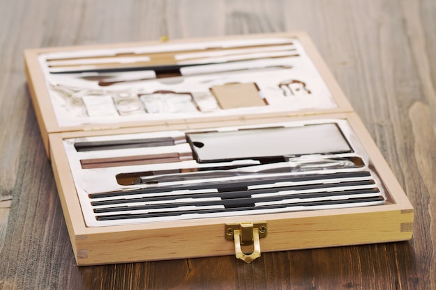 Paint box on wooden table