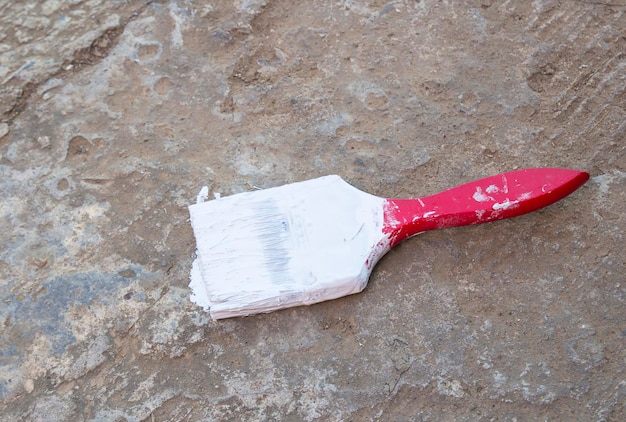 Photo paint brush on the cement floor