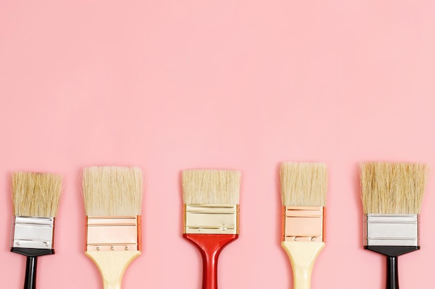 Paint brush on pink background how to choose the perfect home paint color and good for health