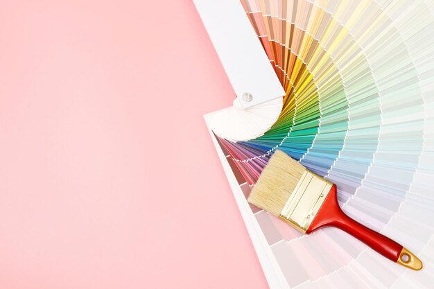 Paint brush on pink background how to choose the perfect home paint color and good for health