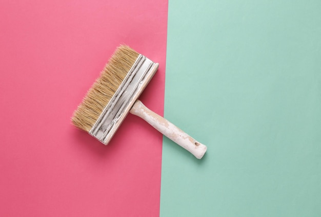 Photo paint brush on pink blue background minimalism