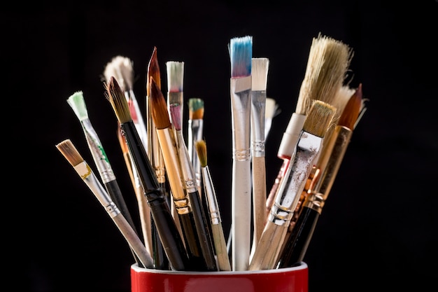 Paint brushes in mug