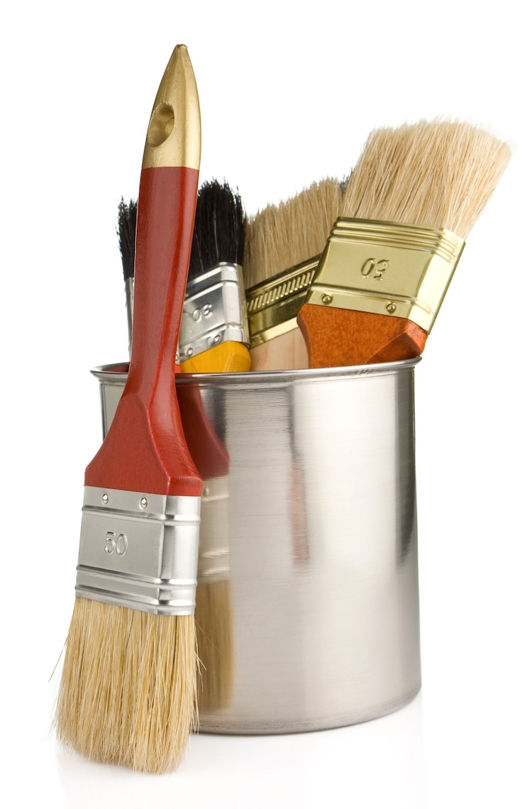 Photo paint buckets and paintbrush isolated on white