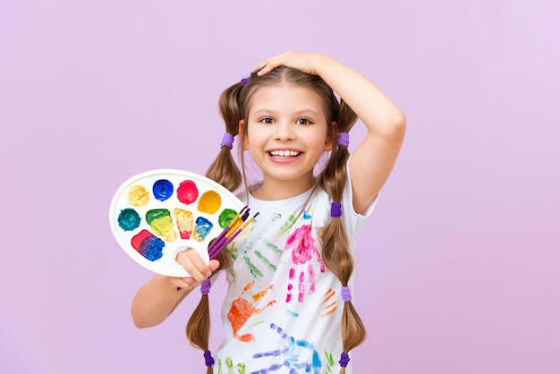 Paint painting school A beautiful girl with paints and brushes on an isolated background Development of children's creativity