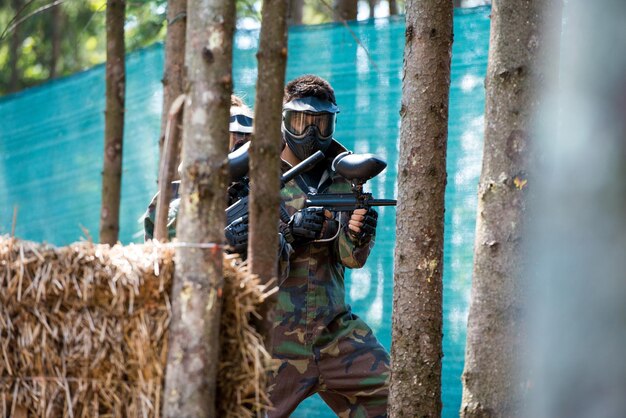 Paintball players running