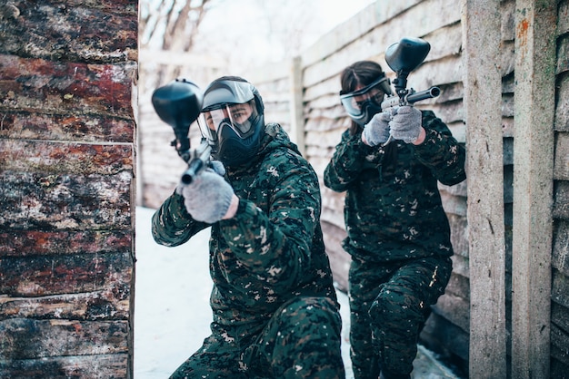 Paintball team, players in winter battle