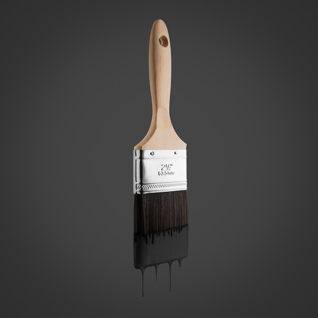 Paintbrush loaded with black color dripping off the bristles- Isolated on black background.