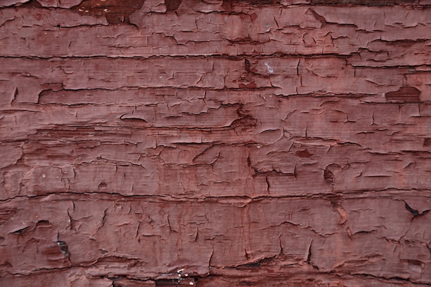 暗い赤の古い木製の壁テクスチャ、素朴な背景を描いた