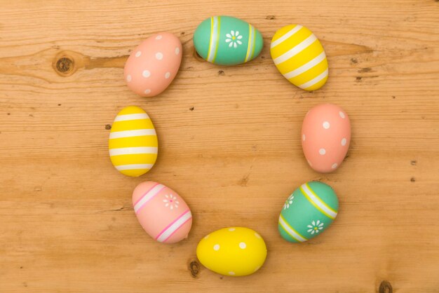 Painted Easter eggs on a wooden background