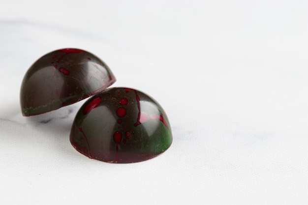 Painted handcrafted chocolate bonbons Delicious dessert